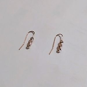 Rose gold colored earrings